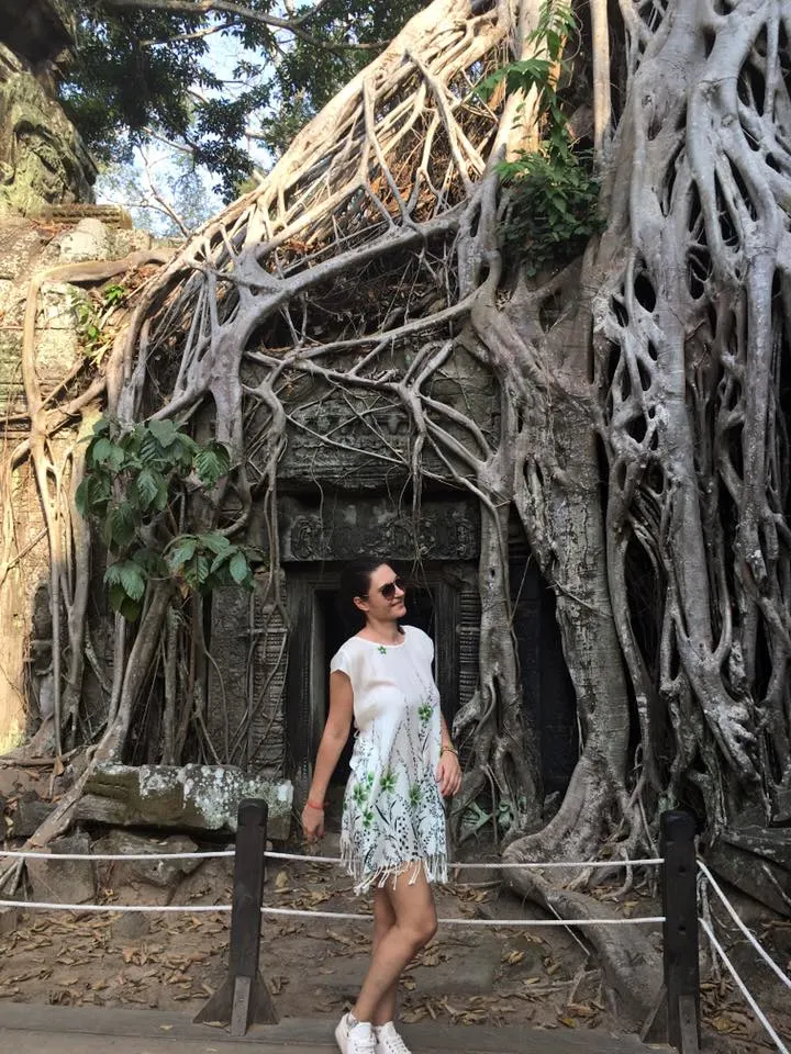 A wanderer in Ta Prohm temple or the Tomb Raider temple Ta Prohm, Cambodia