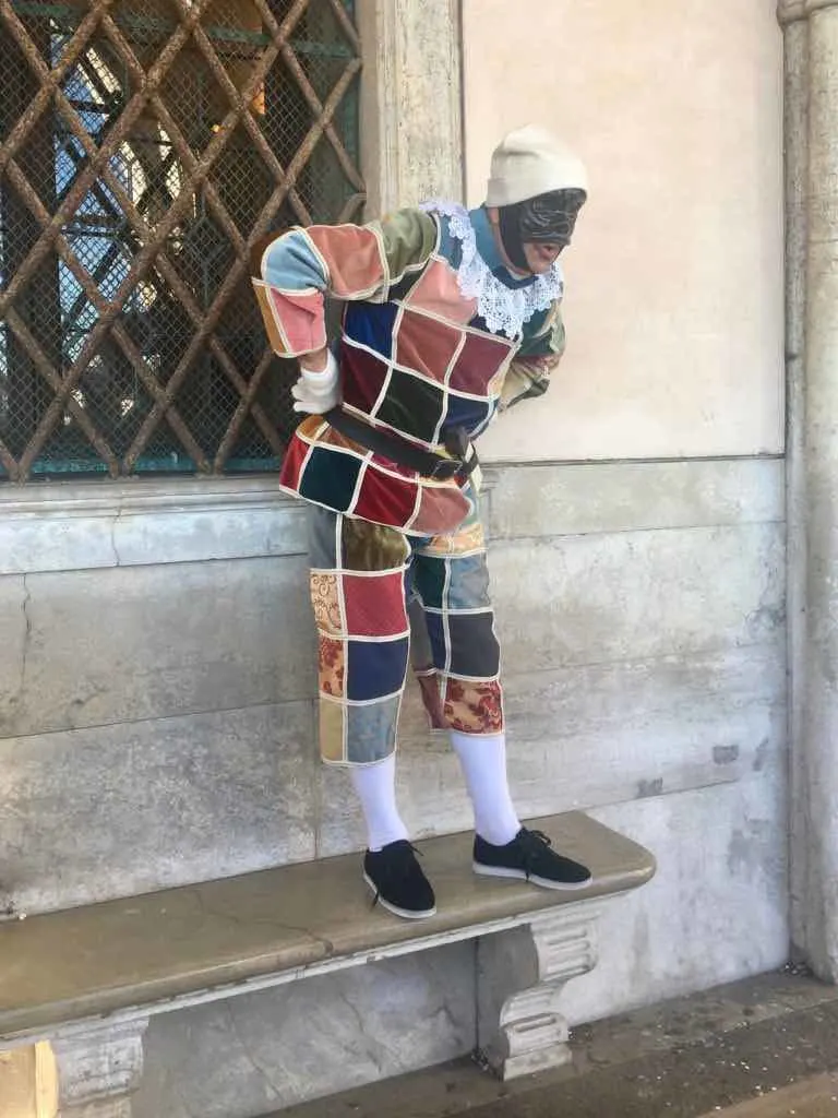 Spectacular Venice Carnival in Italy: Venetian Masks, Pastries, and Wine 13 Joker mask is one of traditional Venetian Carnival Masks