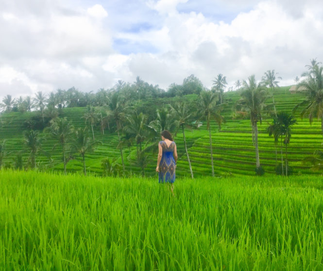 Milijana Gabrić, the travel blogger form WorldTravelConnector.com walking in Jatiluwih Bali rice terraces 