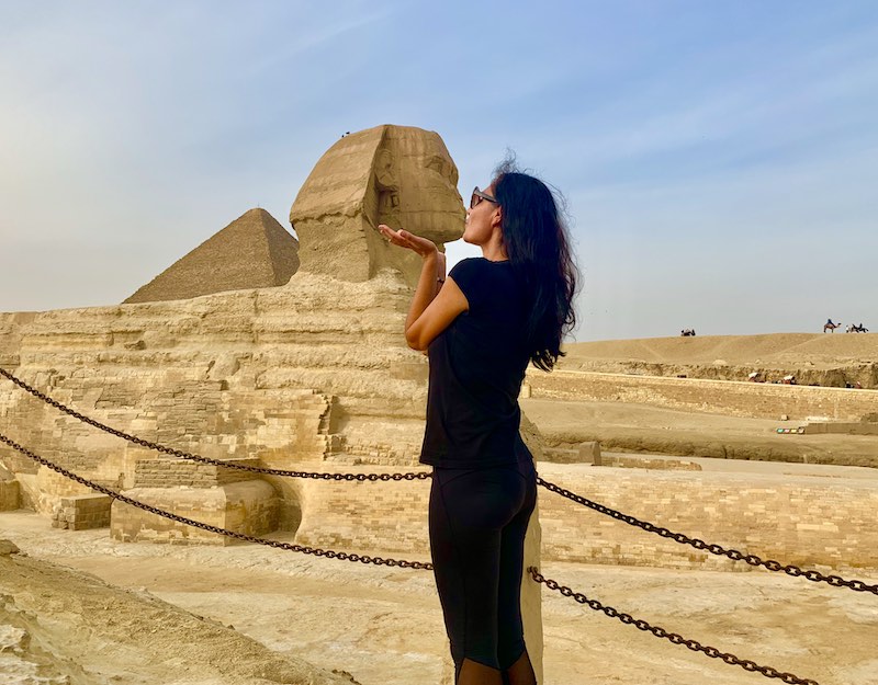 The Great Sphinx of Giza is one of the Egypt landmarks I Milijana Gabric from World Travel Connector kissing the Sphinx in Giza in Egypt