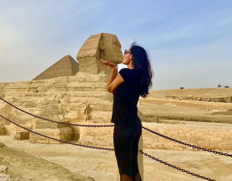 30 Must-See Famous Landmarks in Egypt (2023) 7 The Great Sphinx of Giza is one of the Egypt landmarks I Milijana Gabric from World Travel Connector kissing the Sphinx in Giza in Egypt