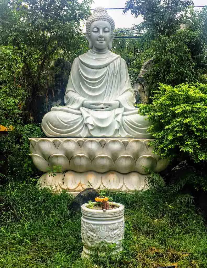 Fat Buddha: Who is the Laughing Buddha 1 Gautama Buddha statue in Hoi An in Vietnam at WorldTravelconnector.com I Skinny Buddha vs Fat Buddha I buddha figure I