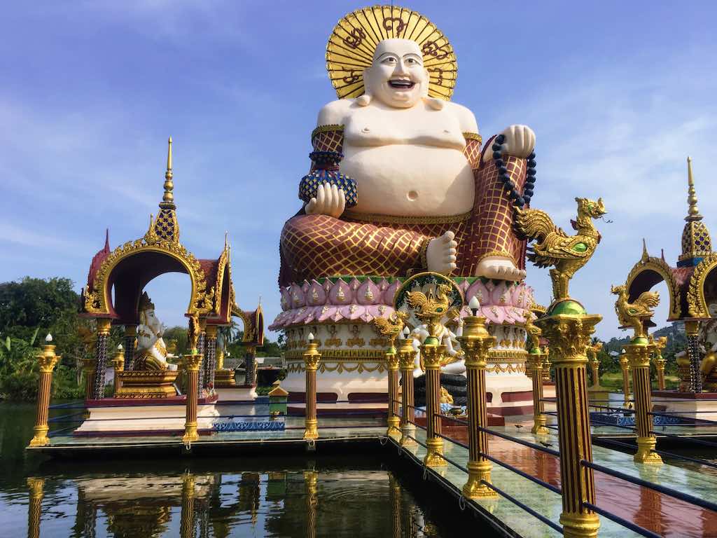 Skinny Buddha vs Flat Buddha Jolly Buddha at Wat Plai Laem in Thailand