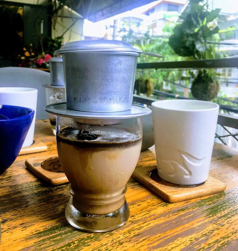 Vietnamese iced coffee is one of amazing Vietnamese coffee types to try in Vietnam I Coffee in Vietnam by WorldTravelConnector.com I Traditional Vietnam coffee I Vietnamese iced coffee I Iced coffee in Vietnam