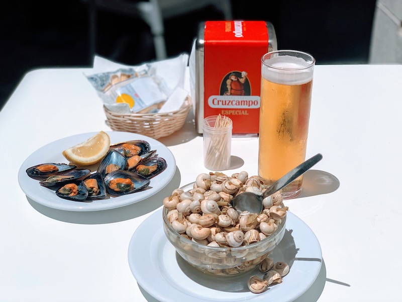 Eating Spanish snails tapas in Cadiz in Spain 