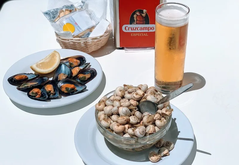 Spanish Tapas Food: 35 Best Spanish Tapas in Spain 32 A Spanish snail tapas bowl