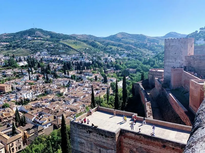20 Essential Alhambra Tips and Tricks: How to visit Alhambra Palace in Granada, Spain in 2023 6 one of the Alhambra tips is for the best views of Granada to go to Alcazaba fortress