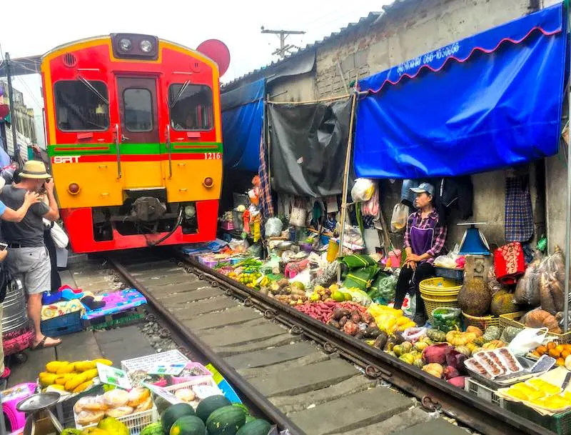 50 Things to Do in Thailand (Thailand Bucket List 2023) 18 Train Market in Bangkok should be on any 10 day Thailand itinerary
