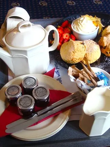 English scones, tea, strawberries and whipped cream