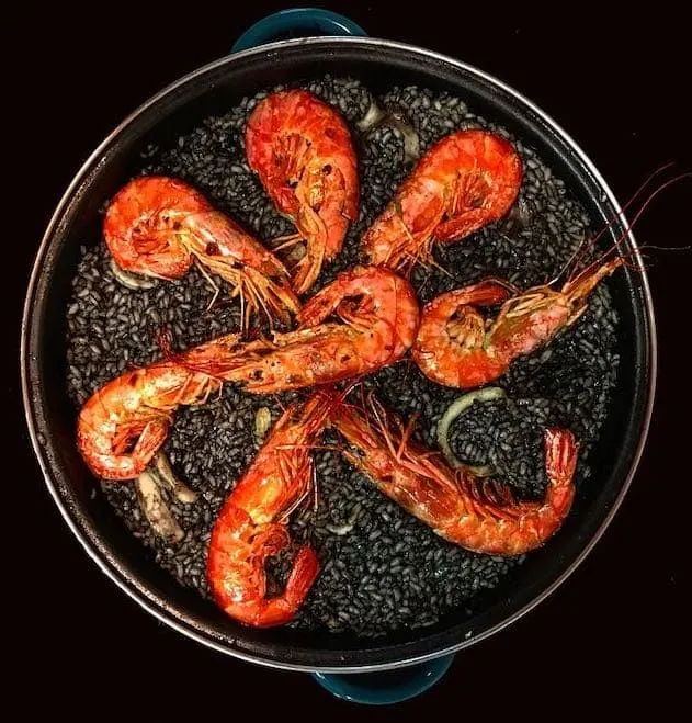 El arroz negro is popular spanish dish from Valencia and Catalonia