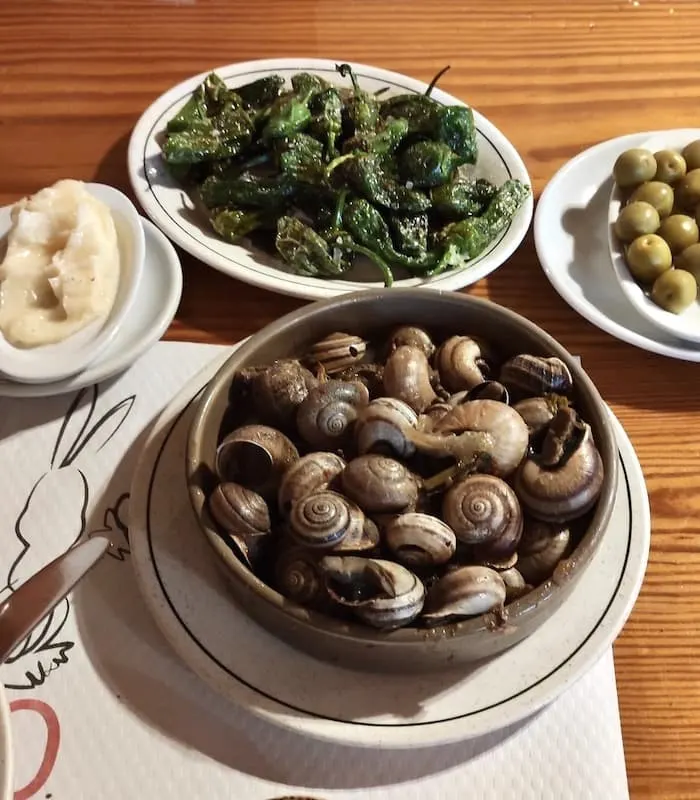 Spanish Tapas Food: 35 Best Spanish Tapas in Spain 33 Caracoles con alioli are favorite Spanish tapas in the springtime