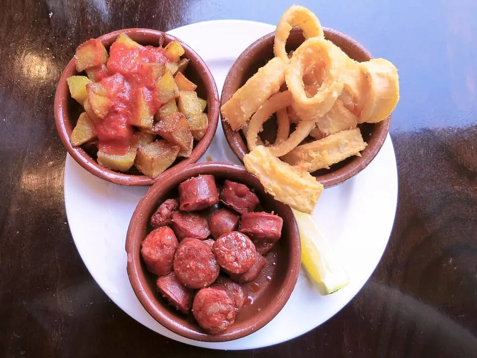 Chorizo a la sidra, patatas bravas and calamares fritos are popular Spanish tapas