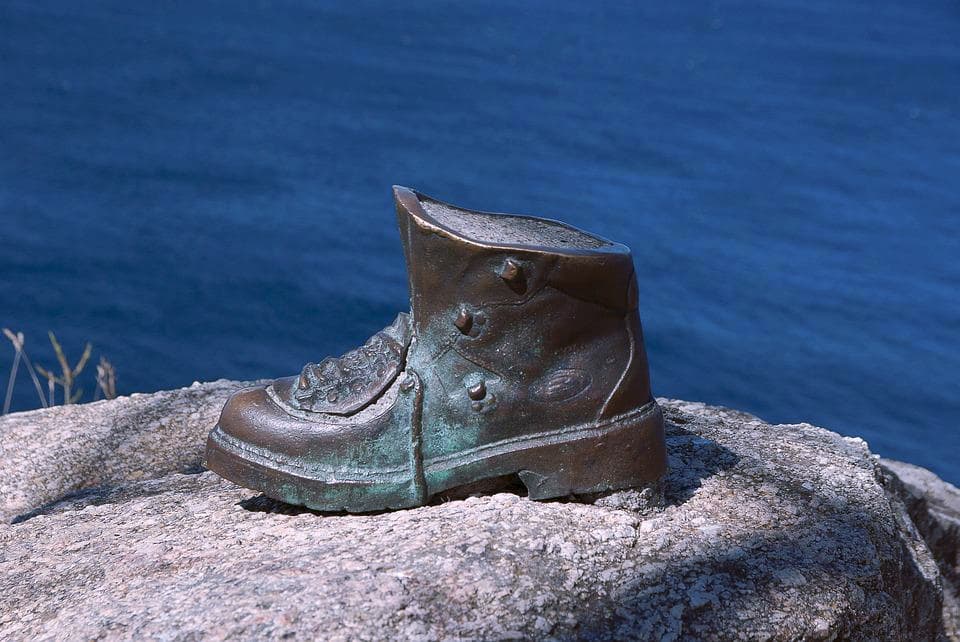 The Pilgrim's boot sculpture next to Fisterra Lighthouse