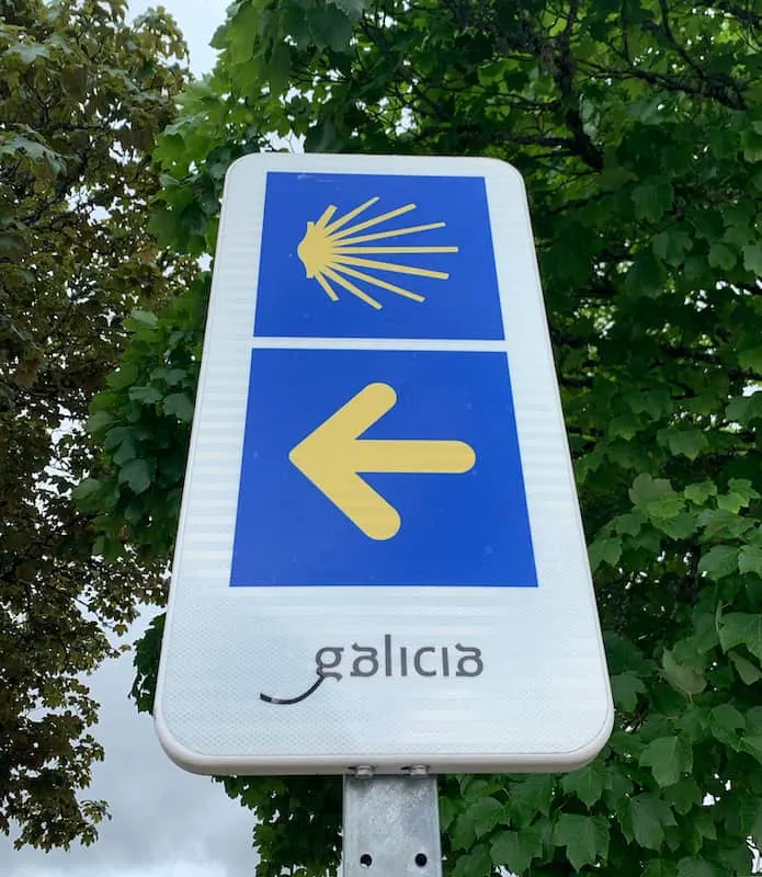 Camino de Santiago yellow arrow and scallop shell