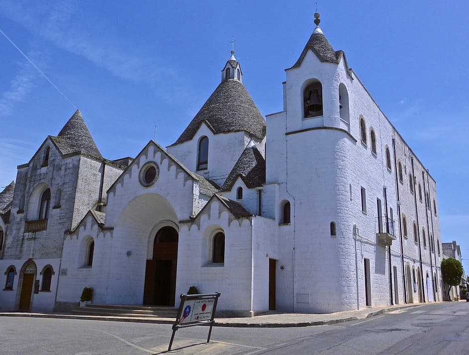 Visiting the trullo style St Anthony church is among the best things to do in Alberobello Italy 
