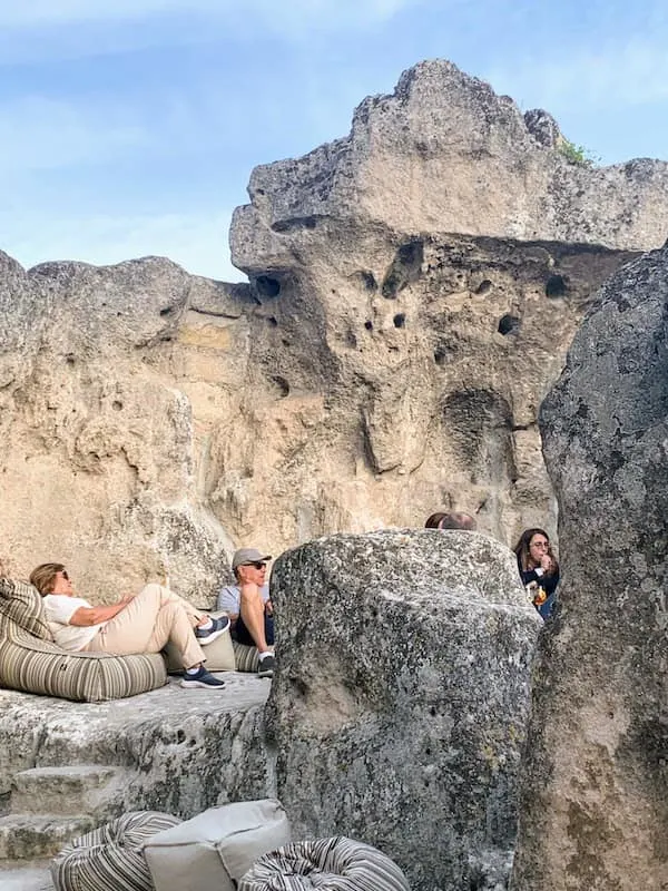 Relaxing among the rocks of Zipa cafe is among the best things to do in Matera Italy 