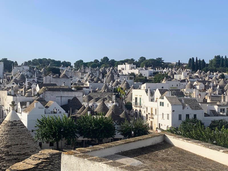 Watching trulli of Rione Monti from Belvedere vista is one of the best things to do in Alberobello Italy 