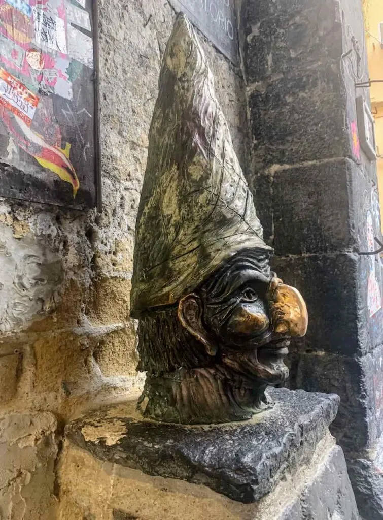 Rubbing the nose of Pulcinella statue is among the best things to do in Naples Italy 