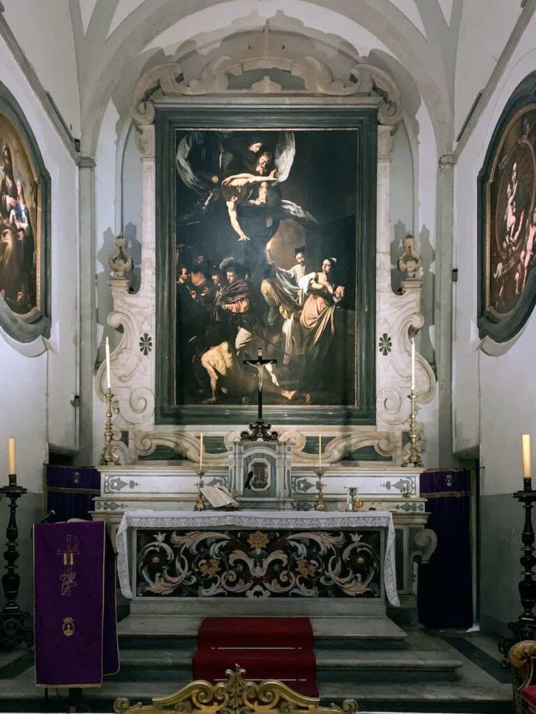 Seeing the Seven Acts of Mercy by Caravaggio  is among the best things to do in Naples Italy 