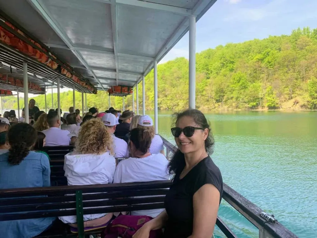 How to Visit Plitvice Lakes National Park (2023) 15 Milijana Gabrić on a ferry on Kozjak Lake in Plitvice Lakes NP
