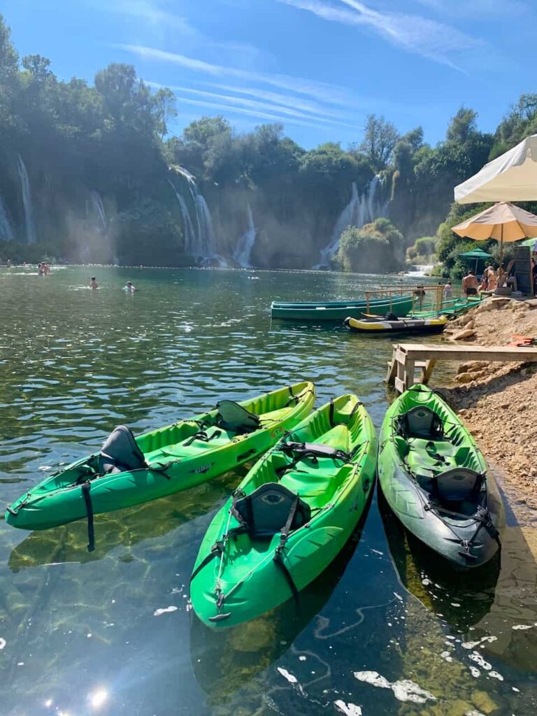 Canoes at Kravice Waterfalls in Bosnia 