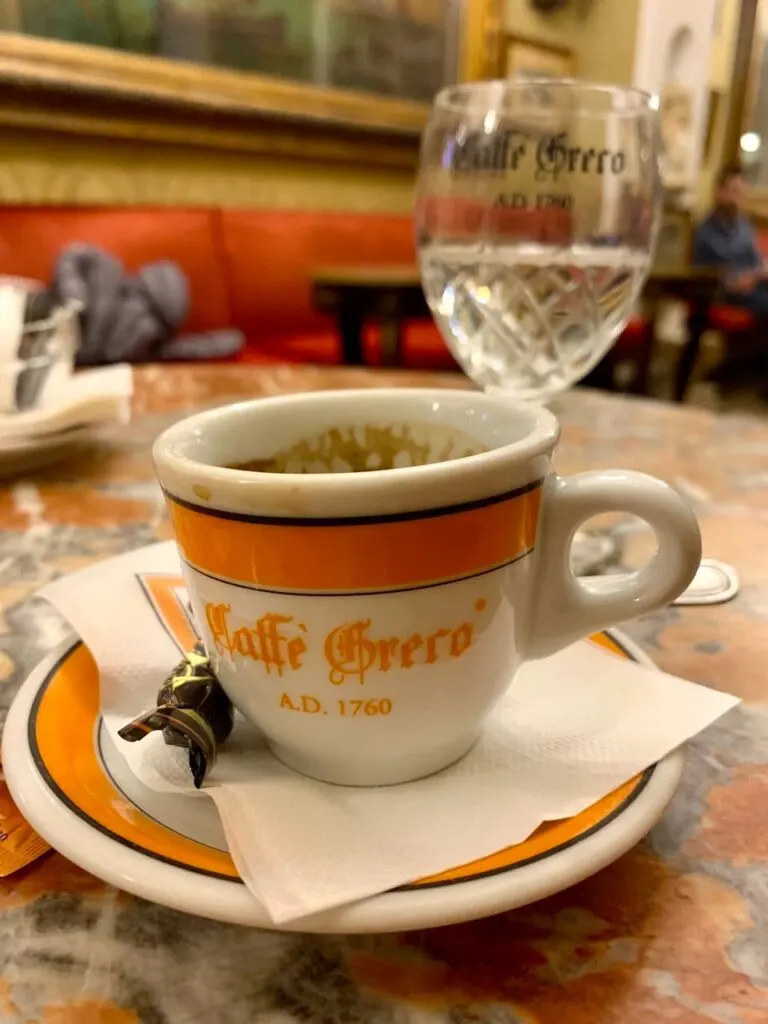 a cup of espresso in Antico Caffè Greco in Rome Italy 