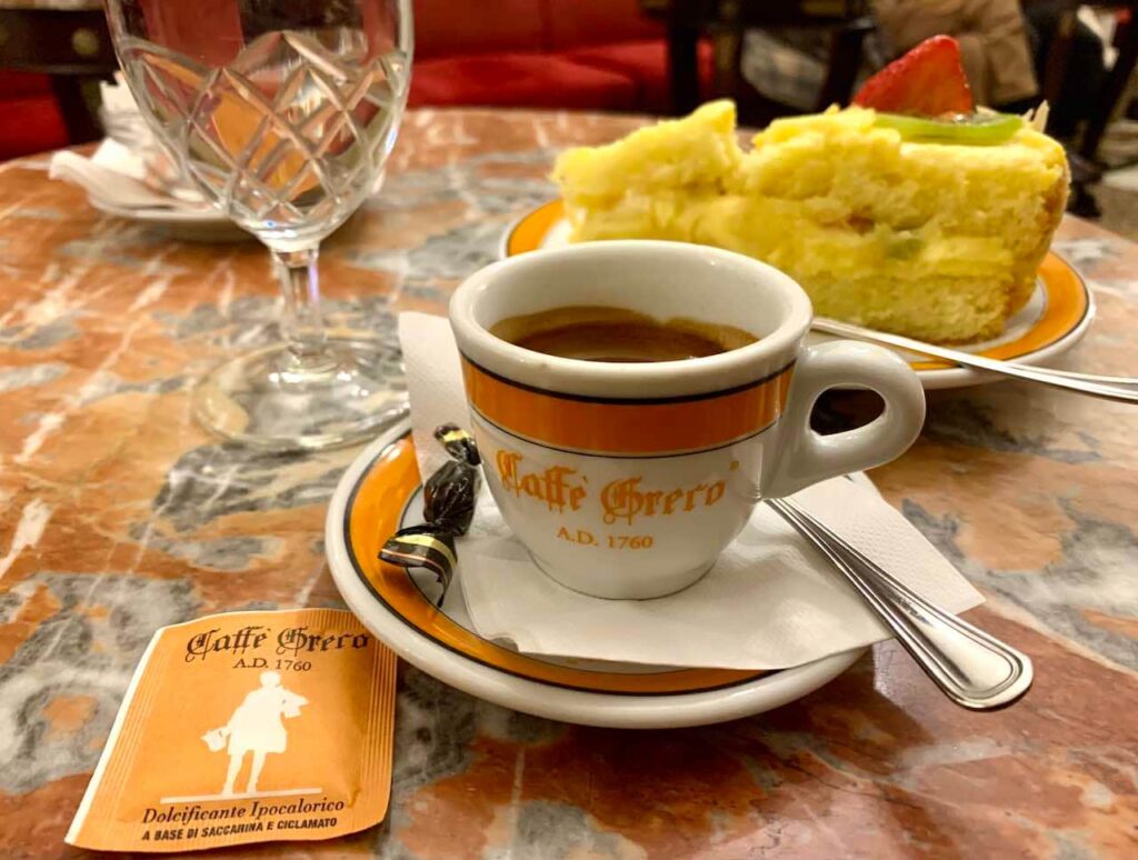 An espresso and a cake Antico Caffè Greco Rome Italy