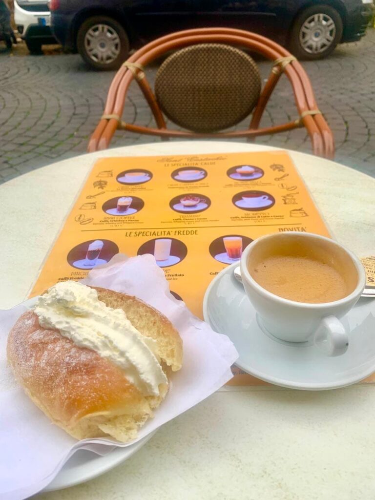 A cup of the Gran Caffe and maritozzo pastry at San Eustacho Il Caffee in Rome Italy 