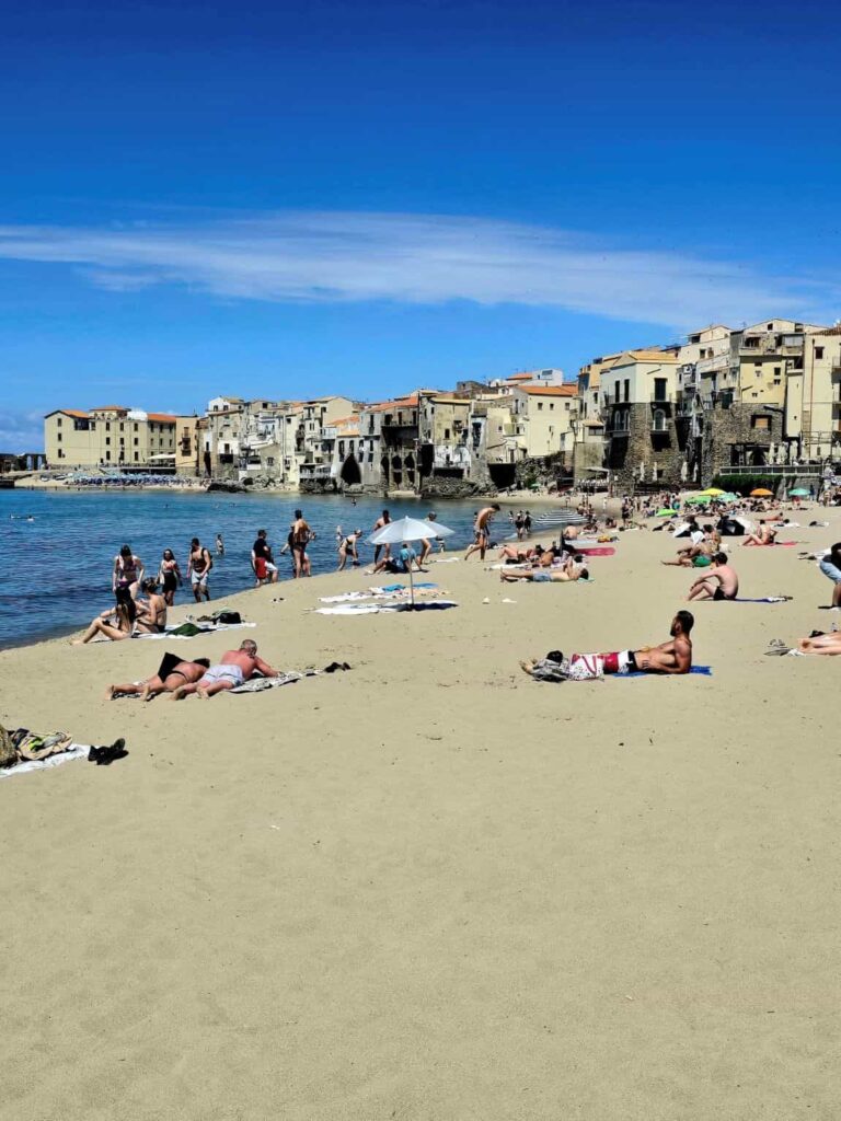 This Sicily’s Seaside Town Looks Straight Out of a Movie—Here’s What to Do in Cefalù 13 Cefalù Beach. Sunbathing and swimming on it is among the best things to do in Cefalu Sicily