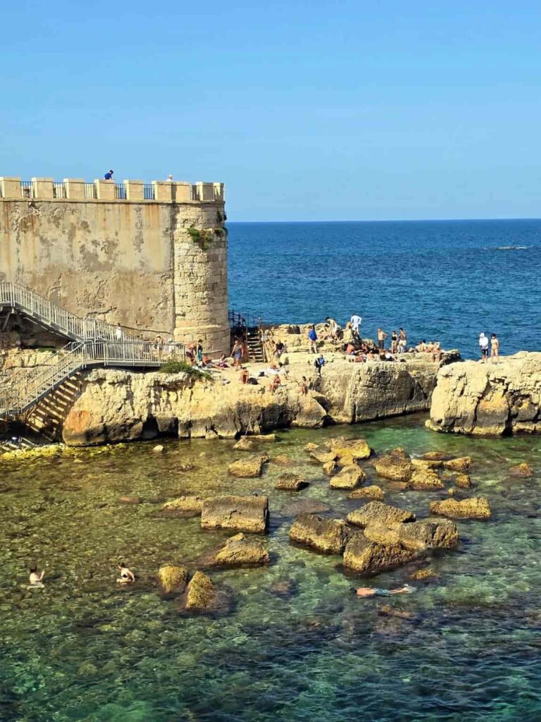 Swimming below the walls of Ortygia, Syracuse Italy