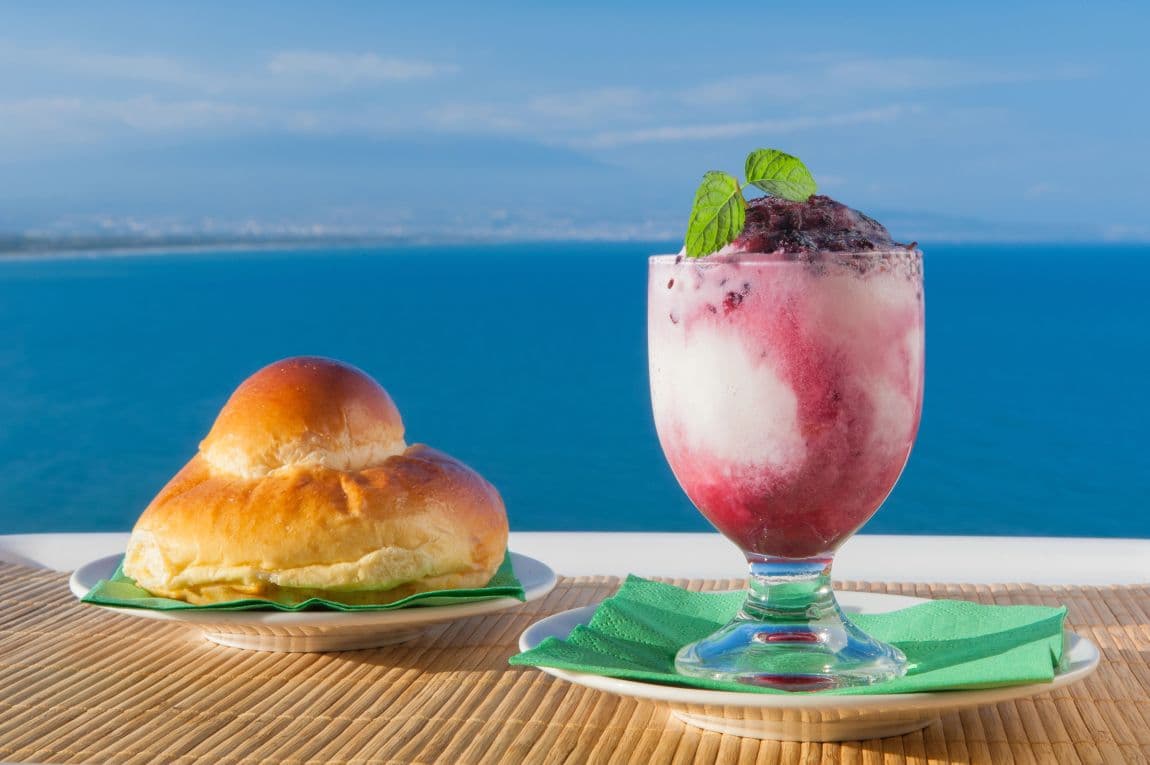 Sicilian granita with a brioche. It is one of the best Sicilian desserts.